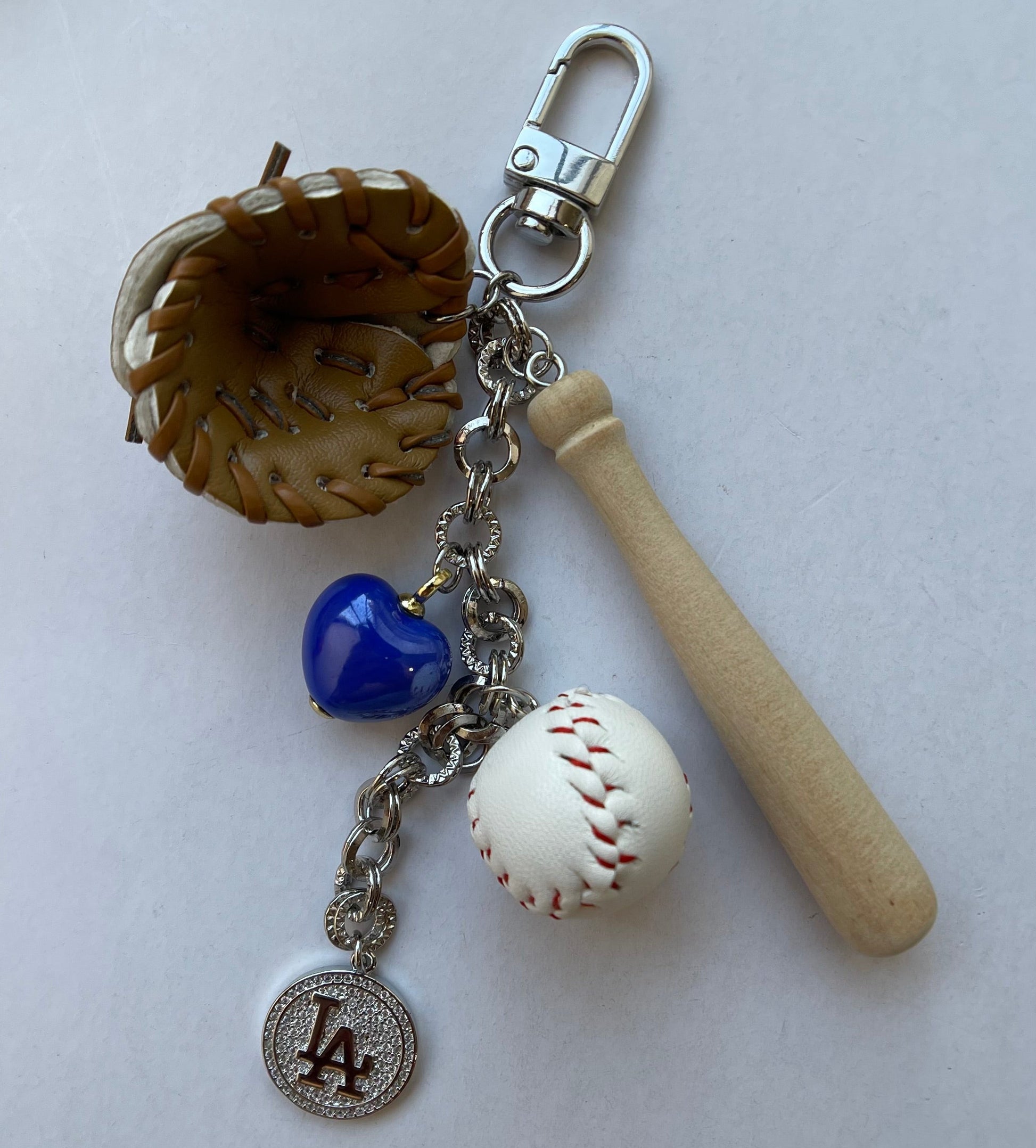 Baseball-themed keychain with a bat, ball, and LA Dodgers emblem on a white background